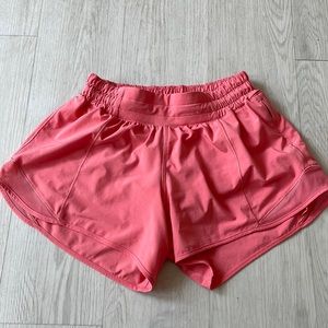 Lululemon hotty hot Low-rise lined short 4” pink/coral color size 4